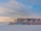 Icebergs in front of Storen Island-frozen into the sea ice of the Uummannaq fjord system during win Art Print